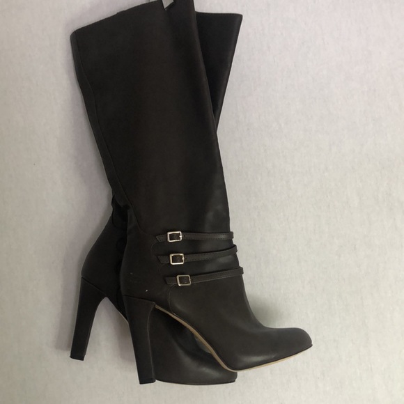 Women’s brown faux leather boots in a size 8 1/2 with a 4 inch heel. - Picture 2 of 7